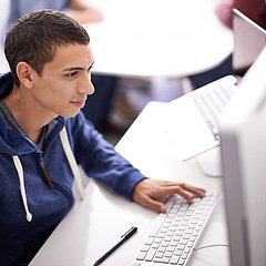 Image showing Young man, computer and typing at office desk for web development, programming or information technology. Business programmer, worker or online designer on multimedia for planning and startup project