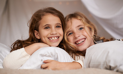 Image showing Happy, home and portrait of children in bedroom for playing, bonding and relax with pillow. Sleepover, friends and young girls on bed with smile, happiness and excited for childhood, fun and laughing