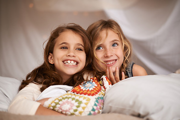 Image showing Happy, sleepover and face of children in bedroom for playing, bonding and relax with toys in home. Laughing, friends and young girls on bed in tent or blanket fort for childhood, fun and happiness