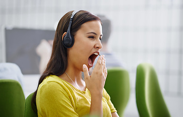 Image showing Woman, headset and yawn or tired in call centre, burnout and mental health for fatigue at helpdesk. Female person, hotline or virtual assistant is exhausted or overworked, consultant and operator