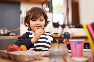 Image showing Child, portrait and brushing egg with paint for colorful art, learning or education in creativity at home. Young boy with smile for color, activity or artwork in early childhood development at house