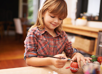 Image showing Happy girl, paint and brushing egg with smile for colorful art, learning or education in creativity at home. Young child enjoying color, activity or artwork for early childhood development at house