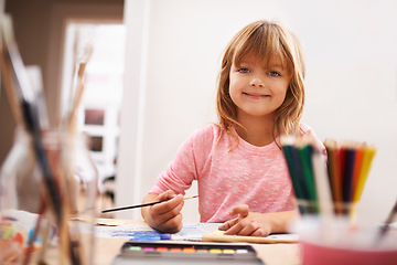 Image showing Happy child, portrait and drawing with color for creativity, learning or education at home. Young girl with paintbrush for sketching, writing or artwork in early childhood development at the house