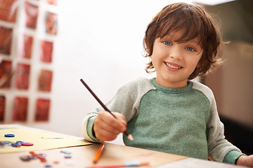 Image showing Happy boy, portrait and drawing with color for creativity, learning or education at home. Young child with smile and pencil for sketching, writing or artwork in early childhood development at house