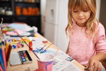 Image showing Happy girl, paint and drawing with color for creativity, learning or education at home. Young child with smile and paintbrush for sketching, writing or artwork on table in happiness at the house