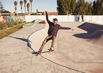 Image showing Fitness, sports and man with skateboard, jump or ramp action at a skate park for stunt training. Freedom, adrenaline and gen z male skater with energy, air or skill practice, exercise or performance