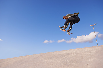 Image showing Skateboard, blue sky and man with ramp, fitness and training for a competition and sunshine. Adventure, person and skater with practice for technique and skating style with exercise, energy or cardio