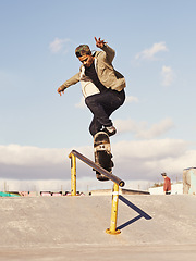 Image showing Energy, fitness and man with skateboard, jump or rail balance at a skate park for stunt training. Freedom, adrenaline and gen z male skater with air, sports or skill practice, exercise or performance