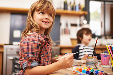 Image showing Little girl, paint and brushing with smile for colorful art, learning or education in creativity at home. Young girl enjoying color, activity or artwork in early childhood development at the house