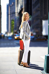 Image showing Business woman, baggage and portrait in road with smile for journey with pride, suit and outdoor. Person, happy and luggage for travel in city on metro sidewalk by skyscraper buildings in New York