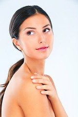 Image showing Thinking, woman and natural beauty with skincare, wellness and glow with dermatology on white background. Cosmetics, self care and touching skin with shine, treatment and moisturizer in studio