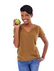 Image showing Woman, portrait and smile in studio with apple for nutrition, healthy diet and wellness on white background. Model, indian person or face with fruit for vitamin c, fiber or lose weight with happiness