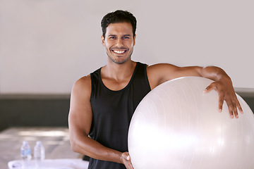 Image showing Portrait, happy man and pilates ball for exercise, workout or training in gym for healthy body in Brazil. Face, smile and person with equipment for sport, wellness or fitness for physical activity