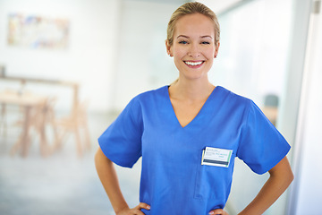 Image showing Happy woman, portrait and nurse with confidence for healthcare, science or career ambition at hospital. Young female person, scrub or medical doctor with friendly smile or PHD of expert at the clinic