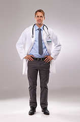 Image showing Man, doctor and confident in studio, portrait and medical professional on gray background. Male person, healthcare and pride for cardiologist career, physician and trustworthy specialist for medicare