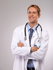 Image showing Man, doctor and thinking on healthcare in studio, medical expert and specialist on gray background. Male person, cardiologist and proud of choice or decision on medicare, planning and idea for health