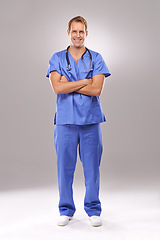 Image showing Man, nurse and portrait in studio, confident expert and specialist on gray background. Happy male person, cardiologist and proud of medicare on mockup space, trustworthy physician and professional