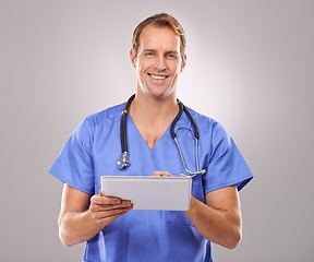 Image showing Tablet, doctor and portrait of man in studio for medical research, insurance and report for hospital. Healthcare, clinic and worker on tech for consulting, telehealth and internet on gray background