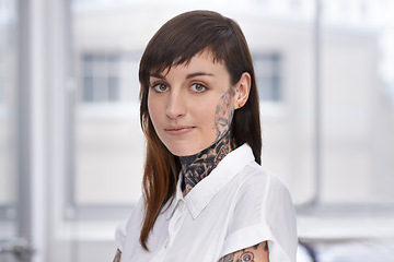 Image showing Business, woman and tattoo with portrait in office with confident attitude, serious and pride with mockup space. Entrepreneur, face of artist and designer with ink skin, body art and grunge aesthetic