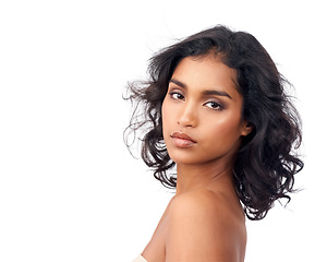 Image showing Beauty, makeup and portrait for Indian woman, skincare and self care on white background. Confidence, hairstyle and curls for face of ethnic female model, natural and salon treatment in studio