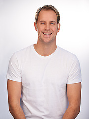 Image showing Man, portrait and smile in studio for relax good mood with white background for positivity, mockup space or cheerful. Male person, face and model with happiness in Canada for carefree, calm or rest