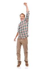Image showing Champion, portrait and man in celebration with fist for winning the lottery, giveaway or achievement on studio background. Excited, person or cheers for surprise news of success in lotto competition
