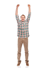 Image showing Studio, portrait and man in celebration for winning the lottery, giveaway or achievement on white background. Happy, person or cheers for surprise success in gambling, competition or excited for news