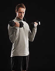 Image showing Man, dumbbells and weightlifting training in studio or fitness performance, workout or black background. Male person, equipment and earphones for music playlist or healthy, streaming or mockup space
