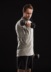 Image showing Man, dumbbells and weightlifting exercise in studio or fitness performance, training or black background. Male person, equipment and earphones for music playlist or healthy, streaming or mockup space