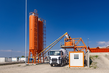 Image showing Vivid orange industrial cement plant