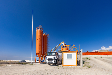 Image showing Concrete batching plant with a mixing tower and cement truck