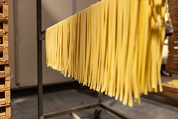 Image showing Fresh pasta drying on racks