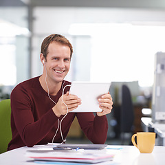 Image showing Tablet, portrait and businessman with earphones, desk and working in office workplace. Smile, technology and watching business videos or streaming, elearning and internet research for online project