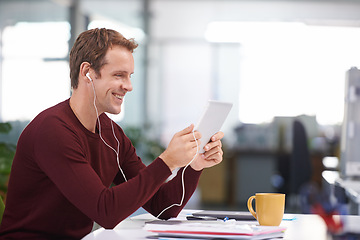 Image showing Tablet, smile and businessman with earphones, watching at desk in office workplace. Happy, technology and business videos or social media streaming, elearning or internet research for online project