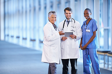 Image showing Portrait, tablet and smile of medical group in hospital for healthcare service in clinic. Happy nurse, diverse team and doctors on technology for collaboration and cooperation of people together