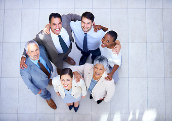 Image showing Huddle, portrait and business people with smile in circle for support, solidarity and partnership. Employee, diversity and professional team with collaboration for meeting, trust and happy from above