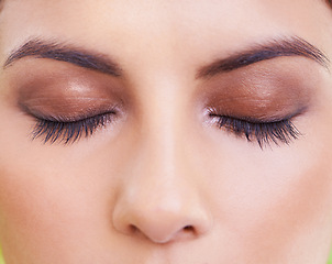 Image showing Eyelashes, face and closeup of woman with makeup, beauty or eyeshadow, shimmer or glow. Eyes, zoom and female model with eyebrow cosmetics, microblading or glamour, aesthetic and lash extensions