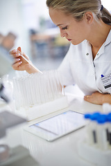 Image showing Woman, scientist and vial with test for exam, research or discovery at the laboratory. Female person or medical professional in science experiment with pipette for chemical compound or DNA study