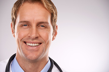 Image showing Man, doctor and portrait in studio, medical expert and specialist on gray background. Happy male person, cardiologist and proud of choice or decision on medicare, trustworthy physician and health