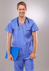 Image showing Clipboard, doctor and portrait of man in studio for medical research, insurance and report for hospital. Healthcare, clinic and worker with documents for consulting and planning on gray background