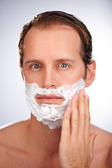Image showing Man, portrait and shaving cream for beard in studio or hair removal maintenance, grooming or white background. Male person, face and product for healthy hygiene with skincare, dermatology or mockup