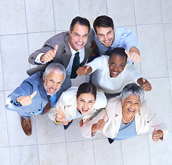 Image showing Portrait, business people and thumbs up for good job, teamwork or collaboration together in office. Top view, emoji and diversity group of employee workers for approval, agreement or yes hand gesture