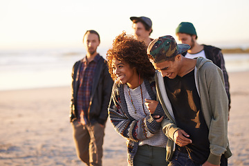 Image showing Travel, beach and laughing friends walking in nature for vacation, bonding or holiday together at sunset. Happy, journey or gen z group of people at sea for fresh air, conversation or ocean adventure