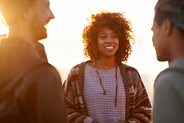 Image showing Sunset, beach and happy friends in nature with conversation, travel or bonding outdoor. Sunrise, adventure and gen z group of people at sea with support, trust or communication on Hawaii vacation