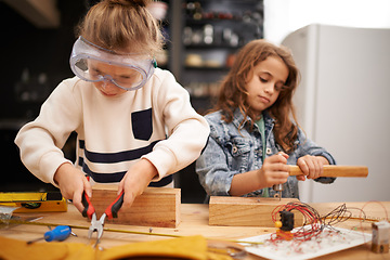 Image showing Play, game and girls with construction, education and learning with fun or safety glasses with hobby or creative. Child development, friends or kids with tools or bonding together with pliers or wood