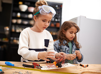 Image showing Child, play and tools for robotics, construction and design for busy and bonding for childhood game. Kids or friend for sibling with wire and tape for crafts, diy or fun indoor for tasks and cute