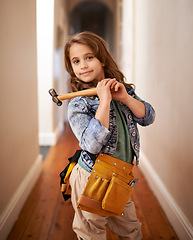 Image showing Child, portrait and ready for construction with hammer, play and artisan game in home. Female person, tool and equipment for remodeling project on weekend, carpentry and woodworking role play