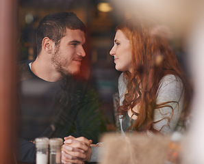 Image showing Couple, happiness and holding hands on date at restaurant for bonding, romance and healthy relationship with relax. Man, woman and lens flare at cafe with smile, trust or love on anniversary vacation