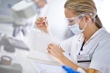 Image showing Woman, scientist and vial with mask for test, exam or research in discovery at laboratory. Female person or medical professional in science experiment with pipette for chemical compound or DNA study