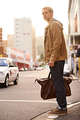 Image showing Morning, street and man in city with bag for travel, commute and journey in urban town. Fashion, walking and person with trendy style, clothes and outfit for holiday, vacation and weekend outdoors